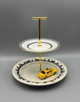 Metropolitan 2 Tier Tray | Fishs Eddy Skyline & Wedgwood Colonnade with yellow taxi sitting on it