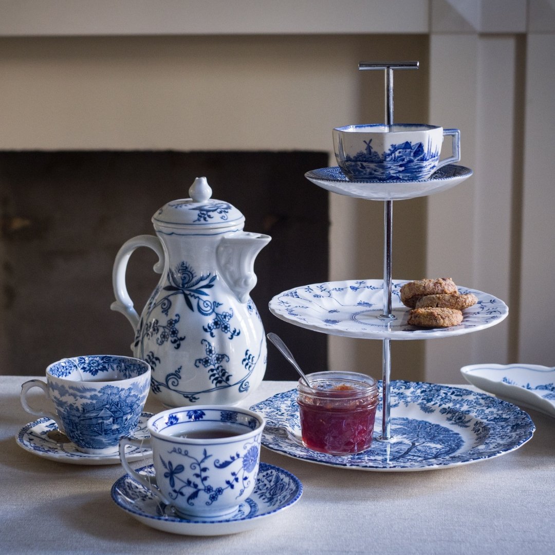 Handcrafted blue and white 3-tier tea tray with teacup top, perfect for tea parties