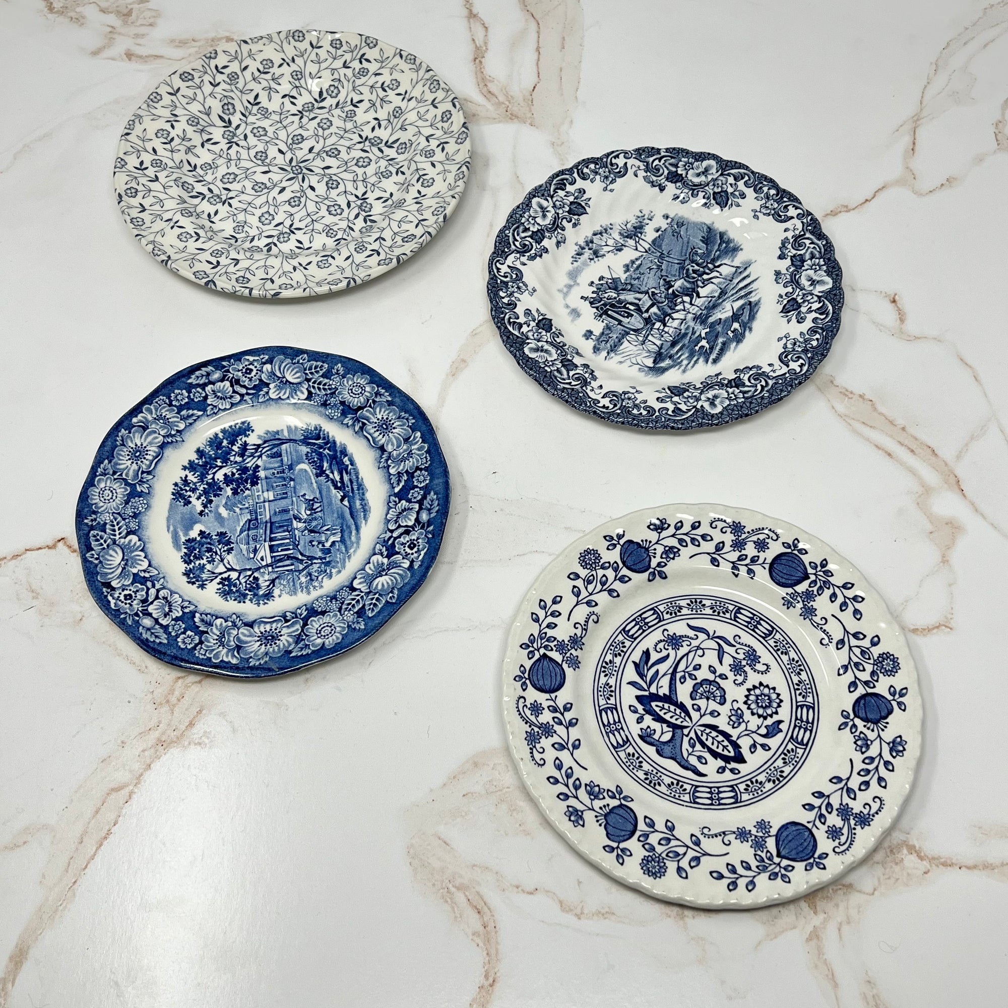 1 floral pattern, 2 colonial patterns and 1 blue onion pattern - example of mismatched set of 4 in the gracious bread & butter plate set