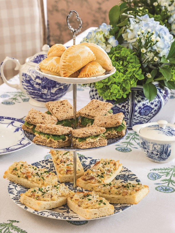 3 Tier Cake Stand used to serve savory snacks and egg salad finger sandwiches. Upcycled from blue and white transferware plates.