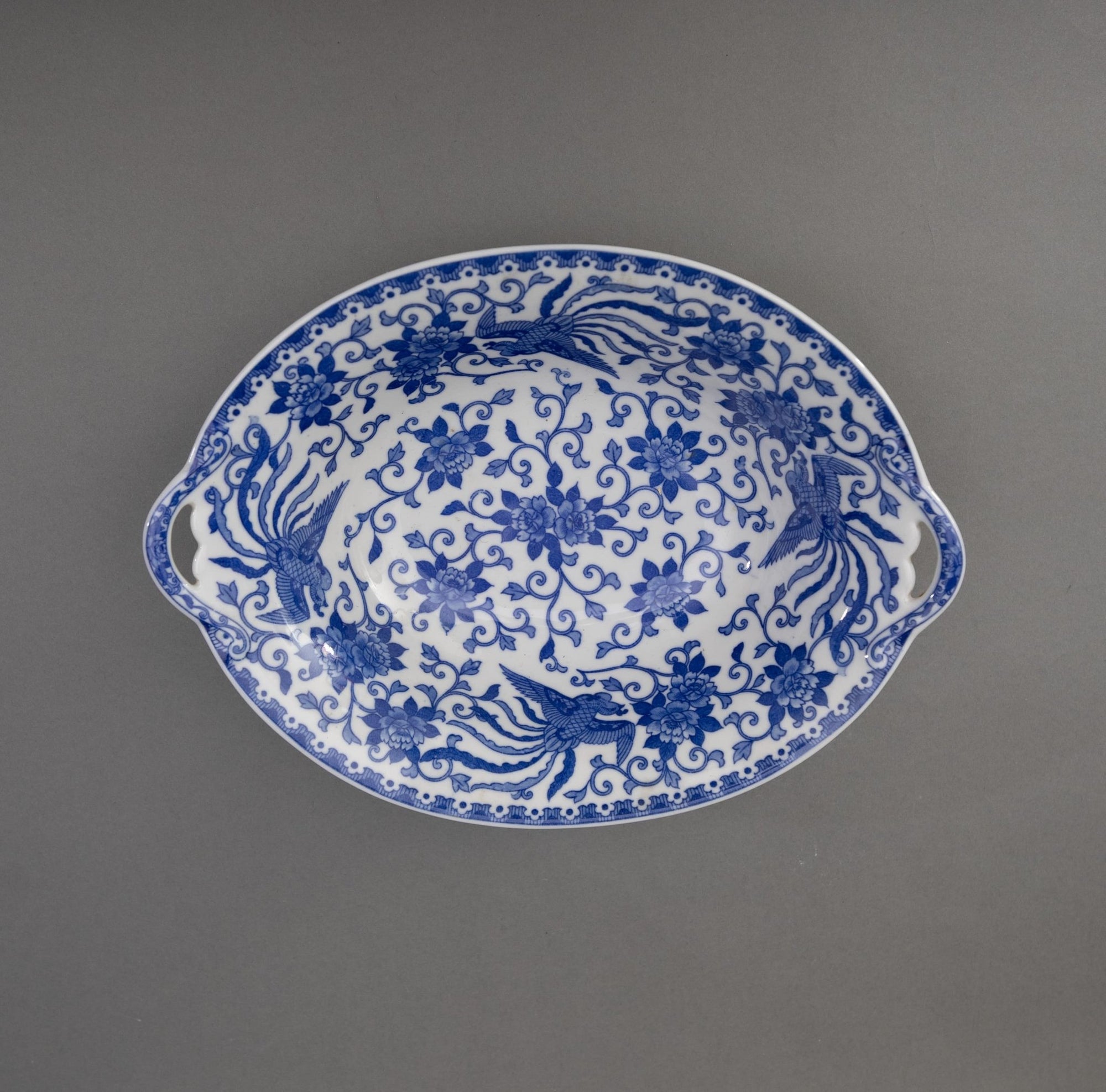 Blue and white oval serving bowls with cut out handles. Phoenix Pattern. Made in Japan.