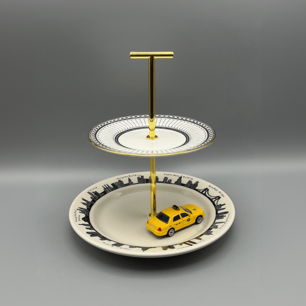 Metropolitan 2 Tier Tray | Fishs Eddy Skyline & Wedgwood Colonnade with yellow taxi sitting on it