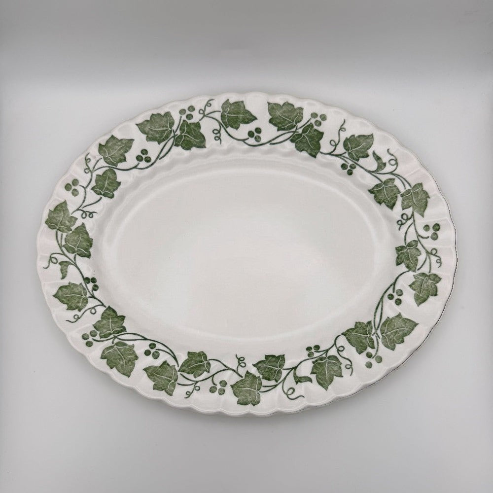 The Brooklyn Teacup Churchill Ivy oval serving platter with green leaf pattern on white ceramic with scalloped edge
