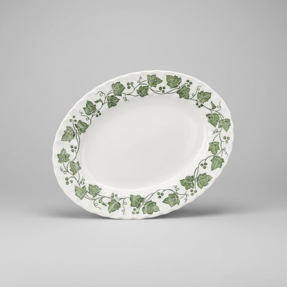 The Brooklyn Teacup Churchill Ivy oval serving platter with green botanical leaf pattern on white ceramic