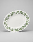 The Brooklyn Teacup Churchill Ivy oval serving platter with green botanical leaf pattern on white ceramic