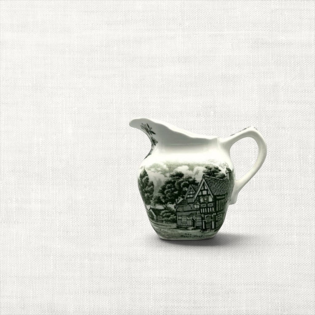 Vintage Grindley green transferware cream pitcher featuring a detailed Tudor inn scene on earthenware