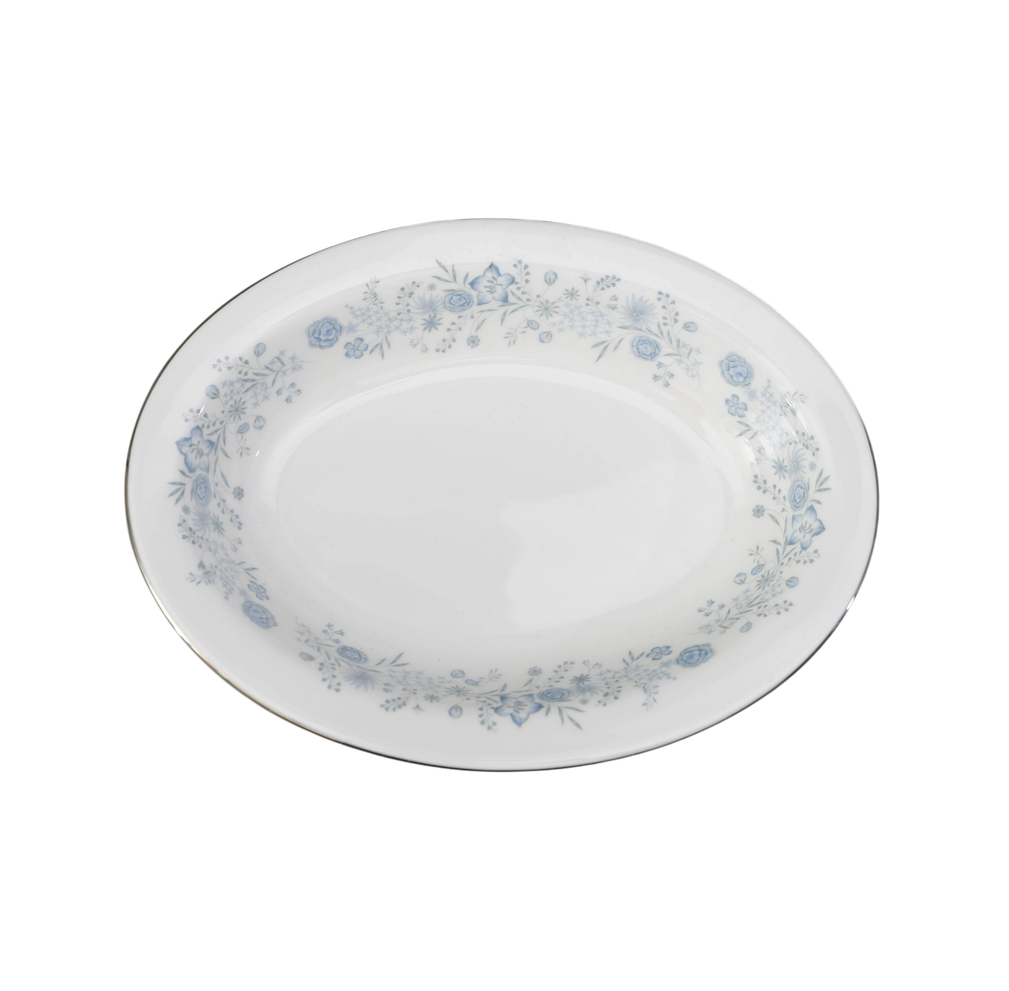 The Brooklyn Teacup oval serving bowl in white porcelain with a delicate blue floral pattern and silver rim.