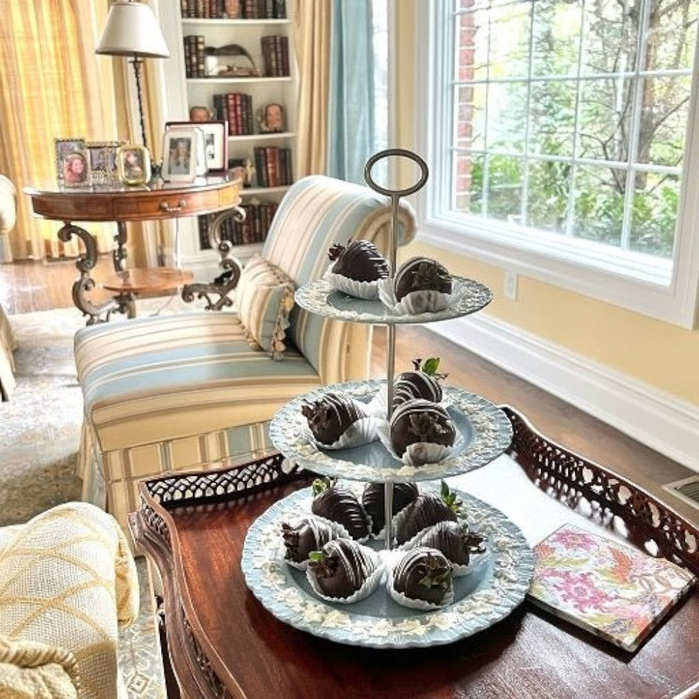 The Brooklyn Teacup custom three-tier tray made from light blue vintage china plates holding chocolate strawberries