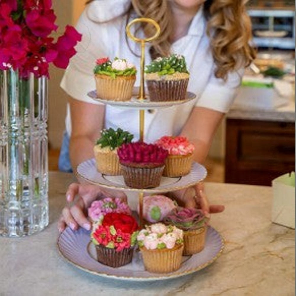 The Brooklyn Teacup custom three-tier cupcake stand made from vintage china plates with gold hardware