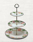 The Brooklyn Teacup Legacy Package featuring a three-tier floral china serving stand with pink rose pattern