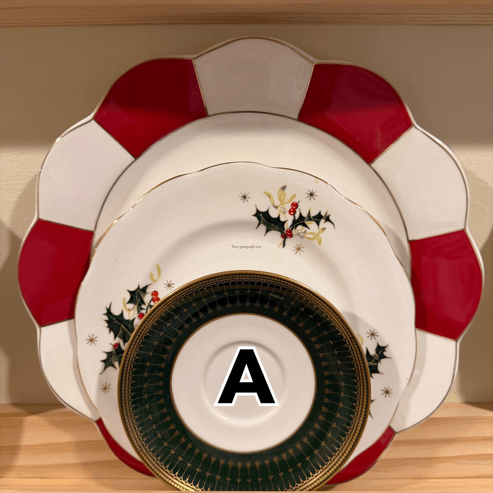 The Brooklyn Teacup vintage 3-tier Christmas tray set featuring red and white scalloped plates with holly motifs.
