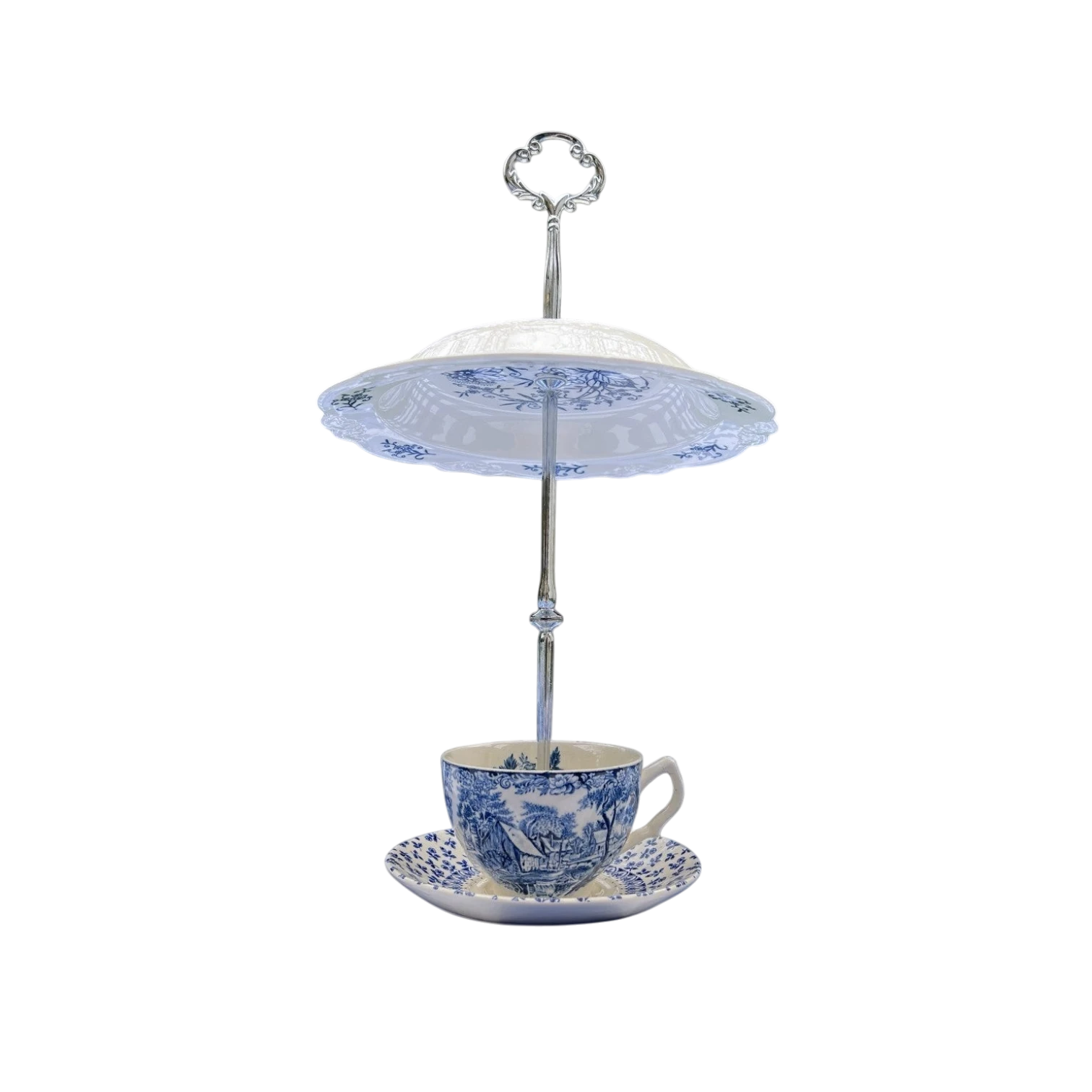 The Brooklyn Teacup's vintage blue and white china teacup bird feeder, made from repurposed china, with intricate landscape or floral patterns.