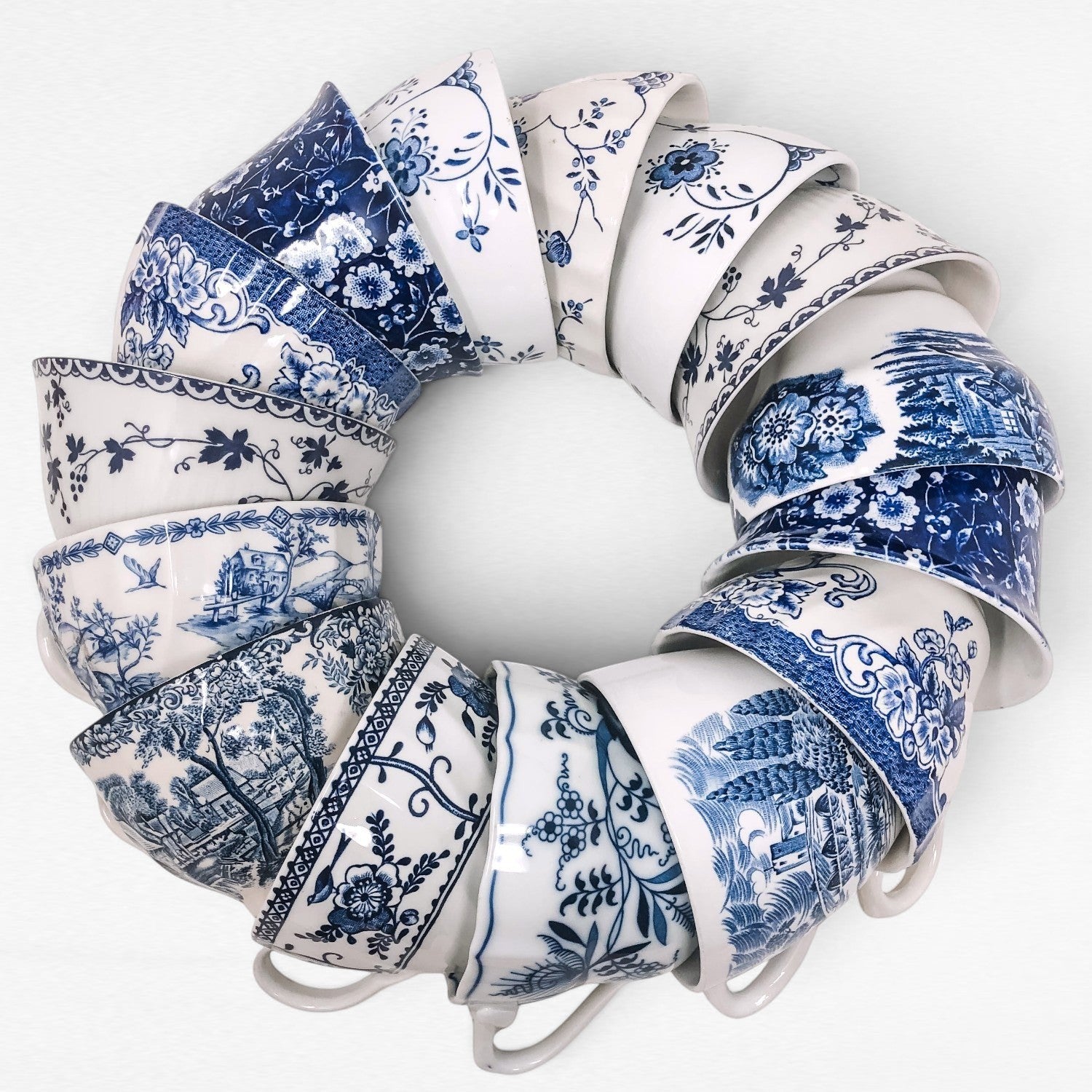 a wreath of blue and white vintage transferware teacups in all different patterns and styles
