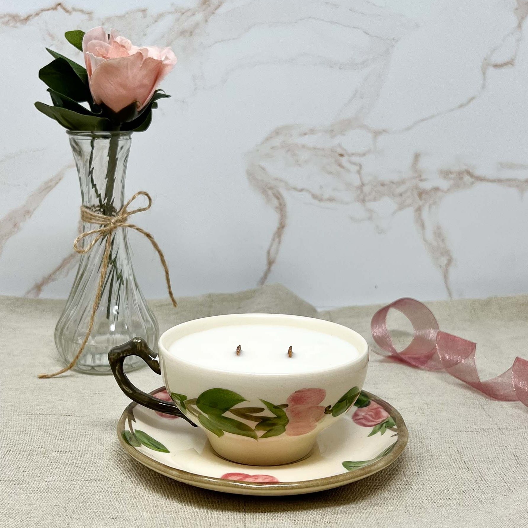 Desert Rose Teacup &amp; Saucer upcycled into a rose scented teacup candle with matching saucer.